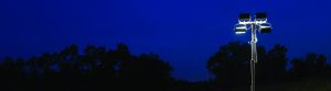 Night sky with lighted floodlight tower
