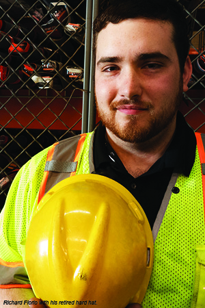Flagger Force employee, Richard Florio, with his retired hard hat.