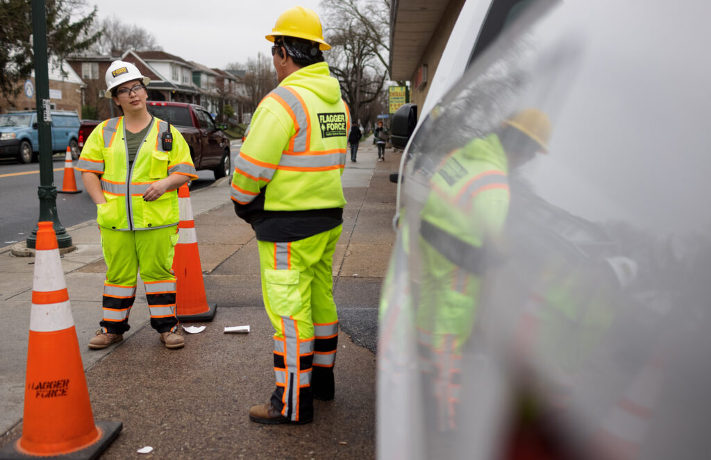 Jackie McVey talking to another Flagger Force field employee on site