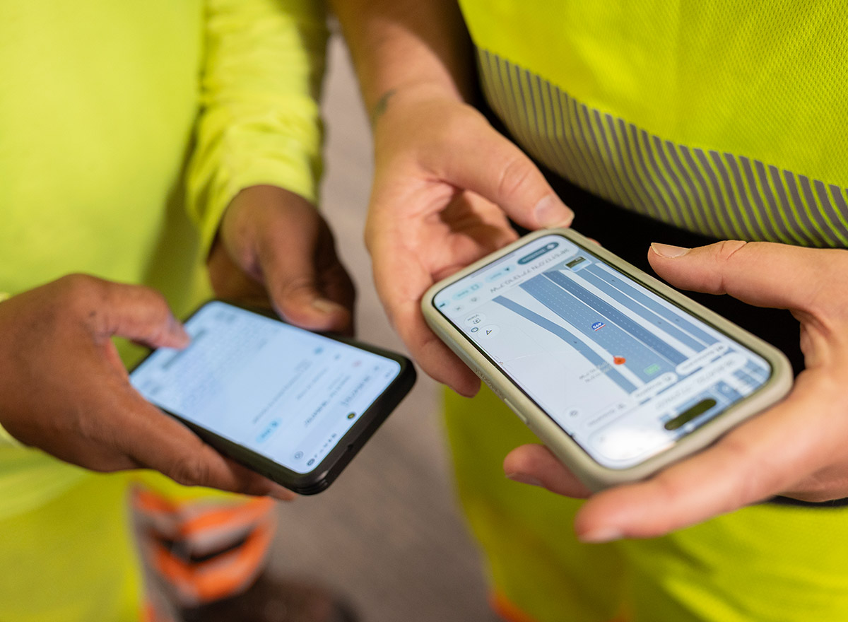 team-using-technology-on-jobsite