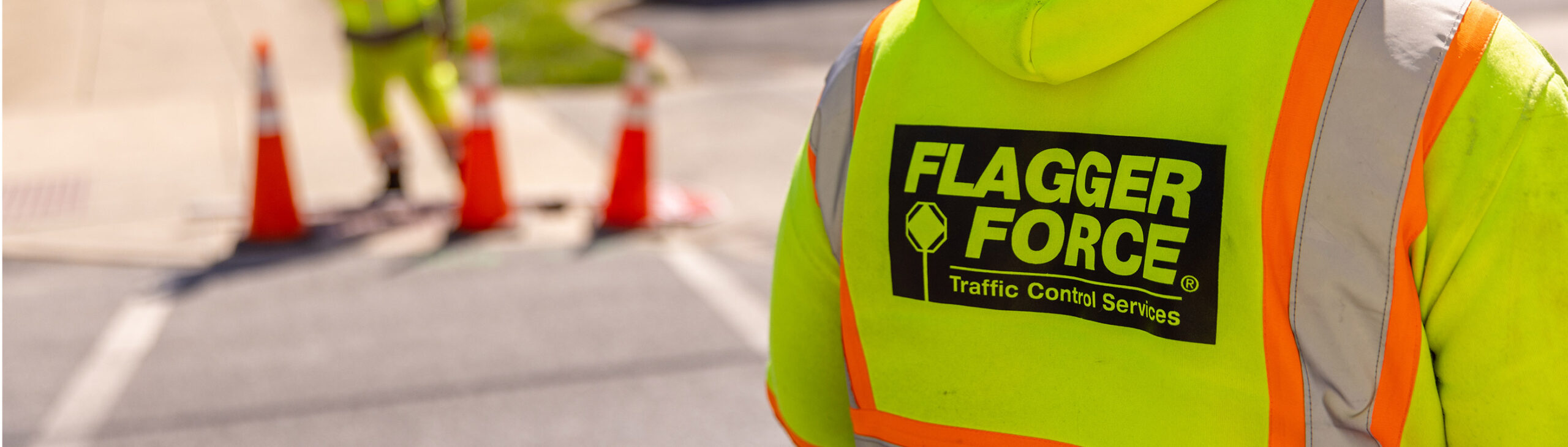 closeup-of-worker-onsite-with-flagger-force-logo-on-back
