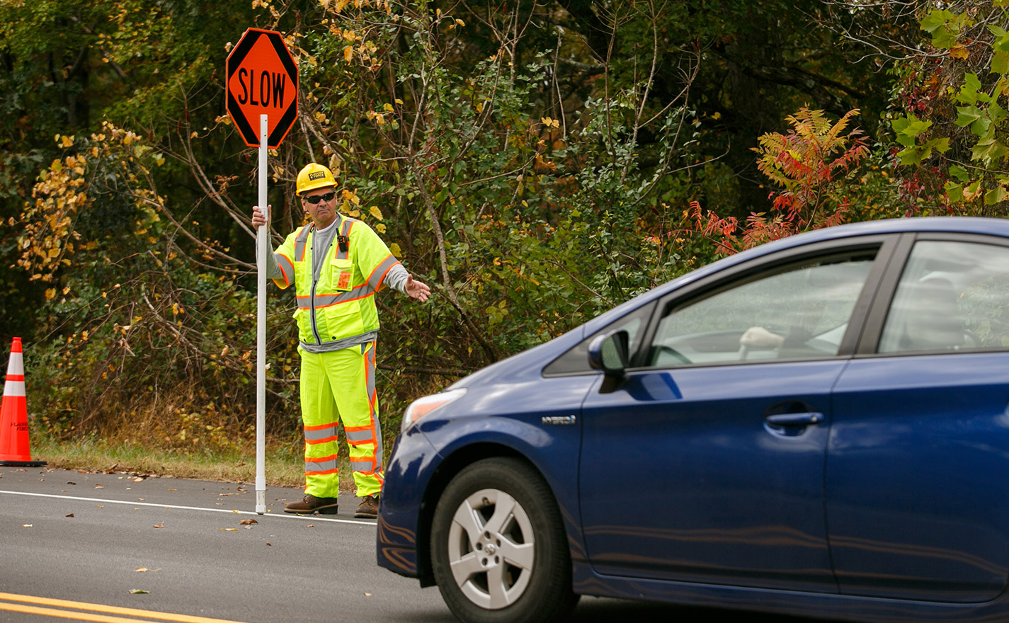Flagger with sign