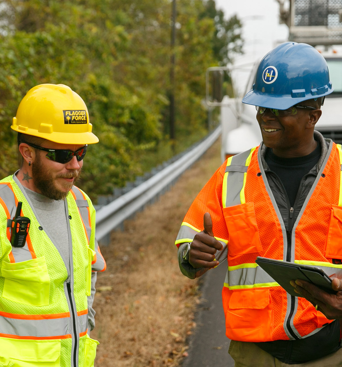 2-field-employees-smiling-on-jobsite.jpg