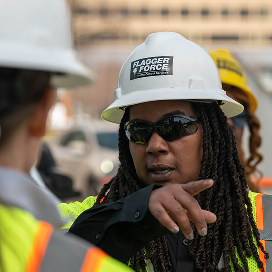 female-leader-talking-to-team-onsite