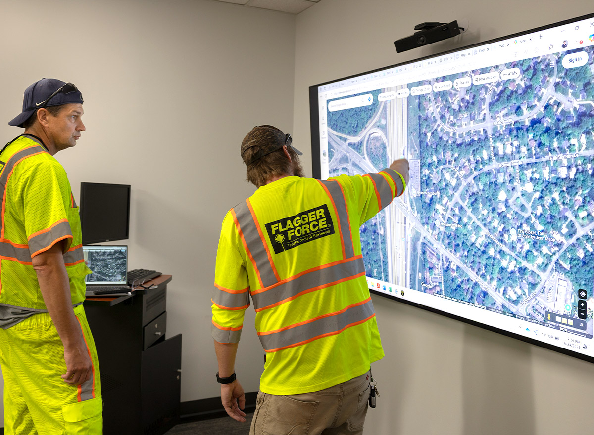 team members in a conference room mapping traffic plans