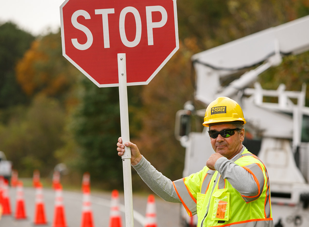 standard-flagging_flagger-force-crew-member-holding-stop-sign