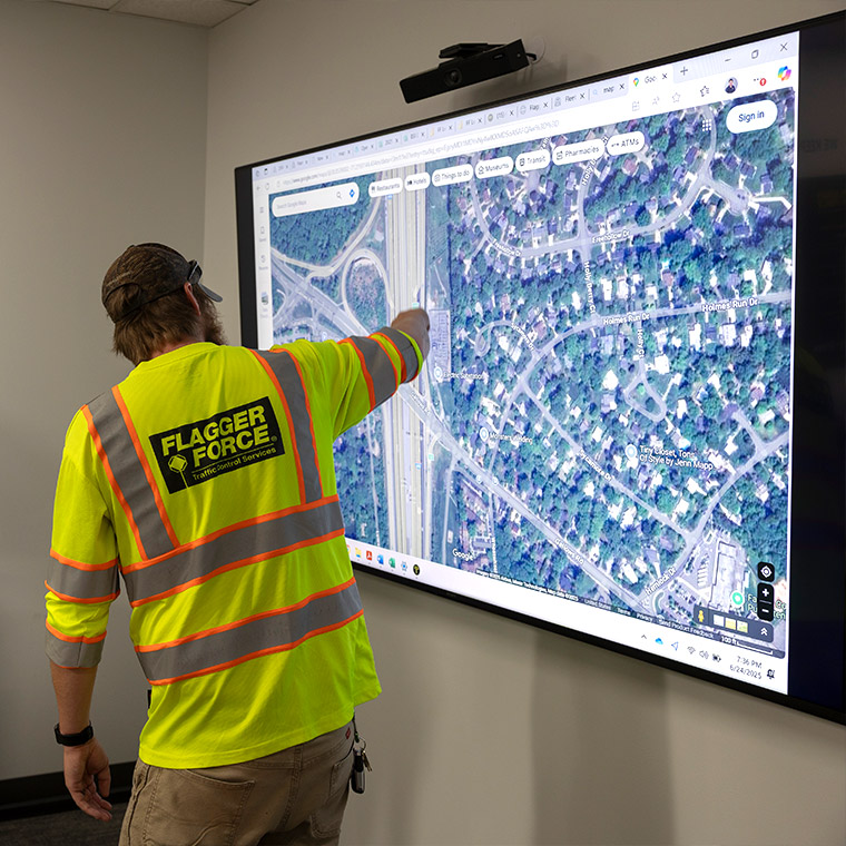 team member using screen to map traffic plans
