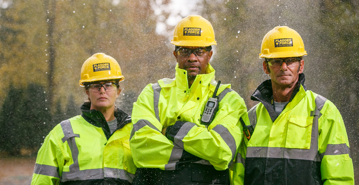 Three Flagger Force field employees standing strong in weather